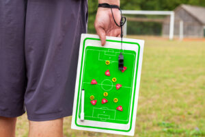 Soccer coach with combination board